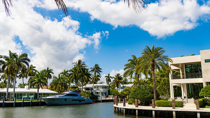 Summer vacation holiday at villa with yacht boat docked in bay harbor